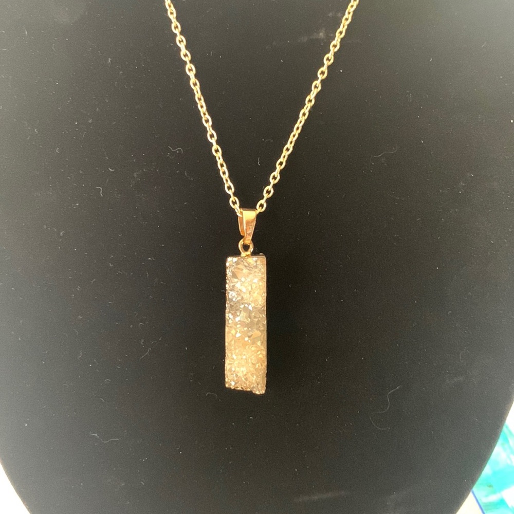 Gold necklace with natural rock pendant